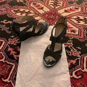 Worn once. Fabulous wedge sandals with patent leather details and back zip